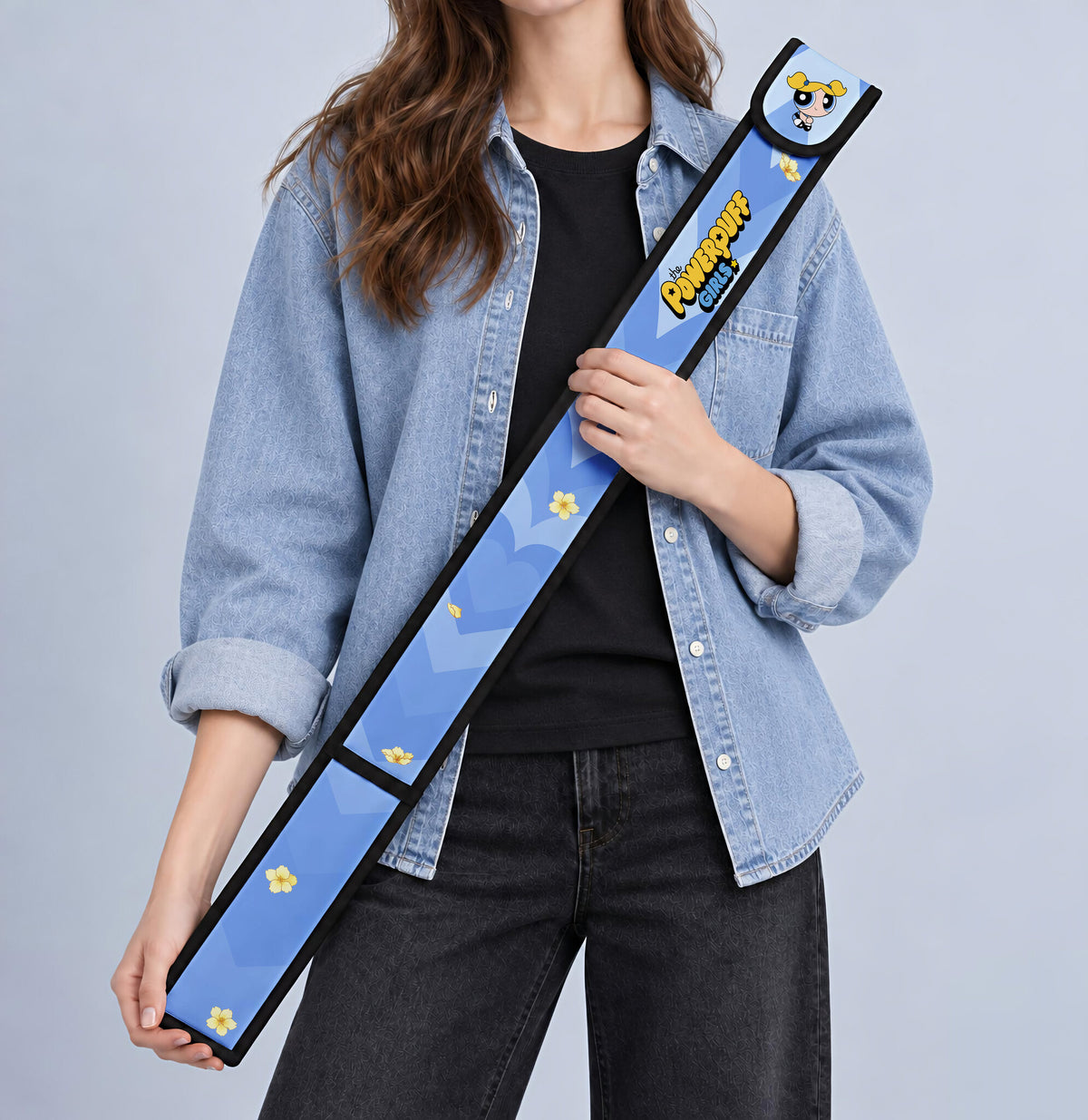 Bubbles T-Ruler Cover held against a denim jacket
